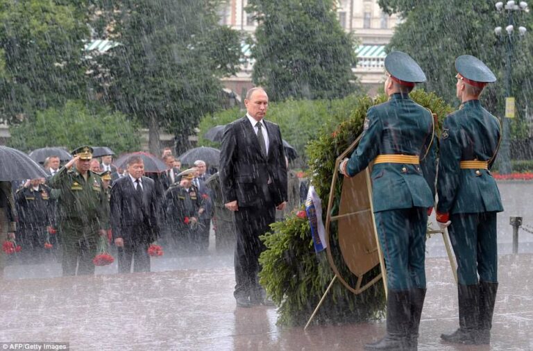Vladimir Putin standing in the rain